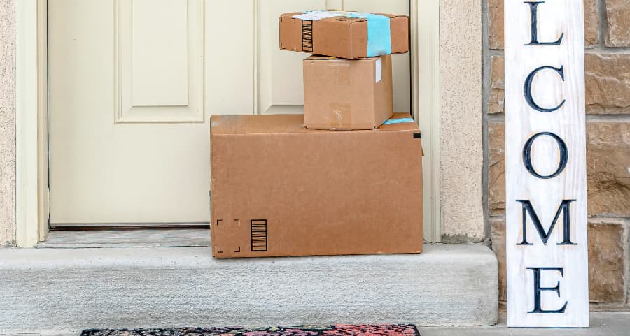 Boxes by the door of a residence with a welcome sign in Texarkana